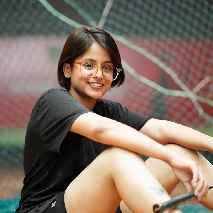 Kaveri Mehta, Lead Design Curator at StoneGrovePort, reviewing corporate floral arrangements